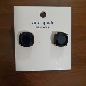 Black and gold Kate Spade studs. The original backs are missing.
